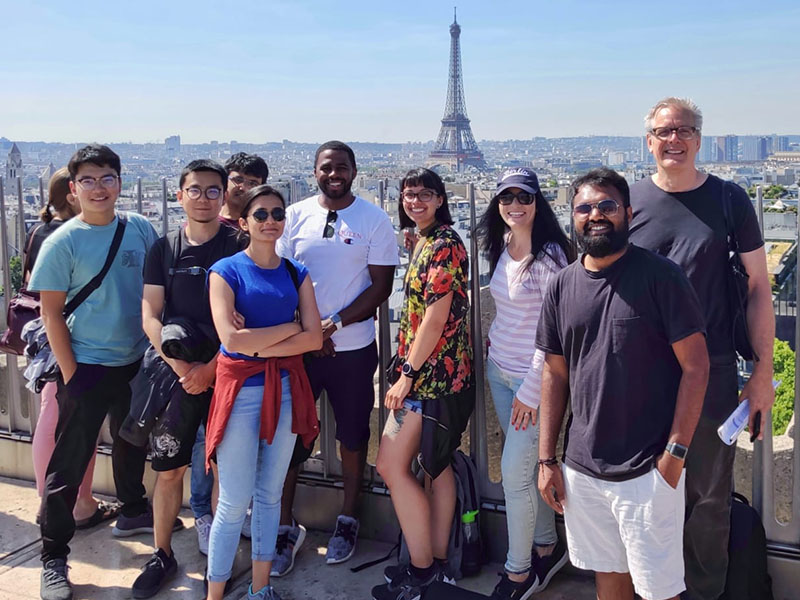 Students and associate professor, W. Jude LeBlanc, in Paris, France viewing the Eiffel Tower from a distance. 