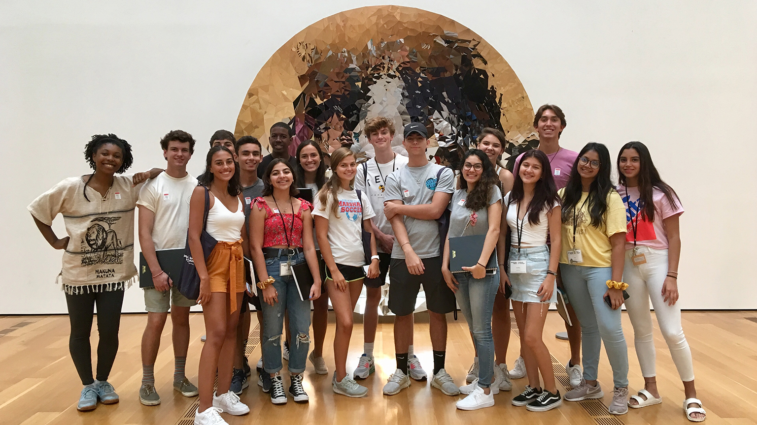 Students from the Summer 2019 Pre-College Camp stand in front of the sculpture at the High Museum of Art.